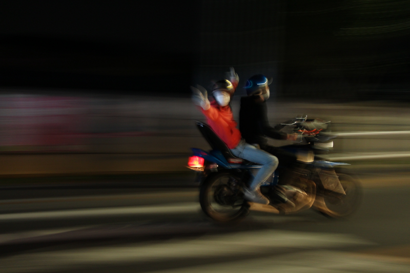 Bosozoku bike and passenger passes us in the night...